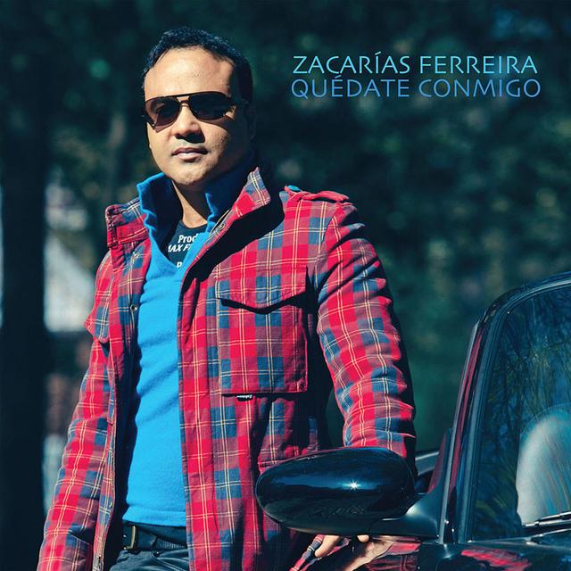 Album cover art for Quédate Conmigo